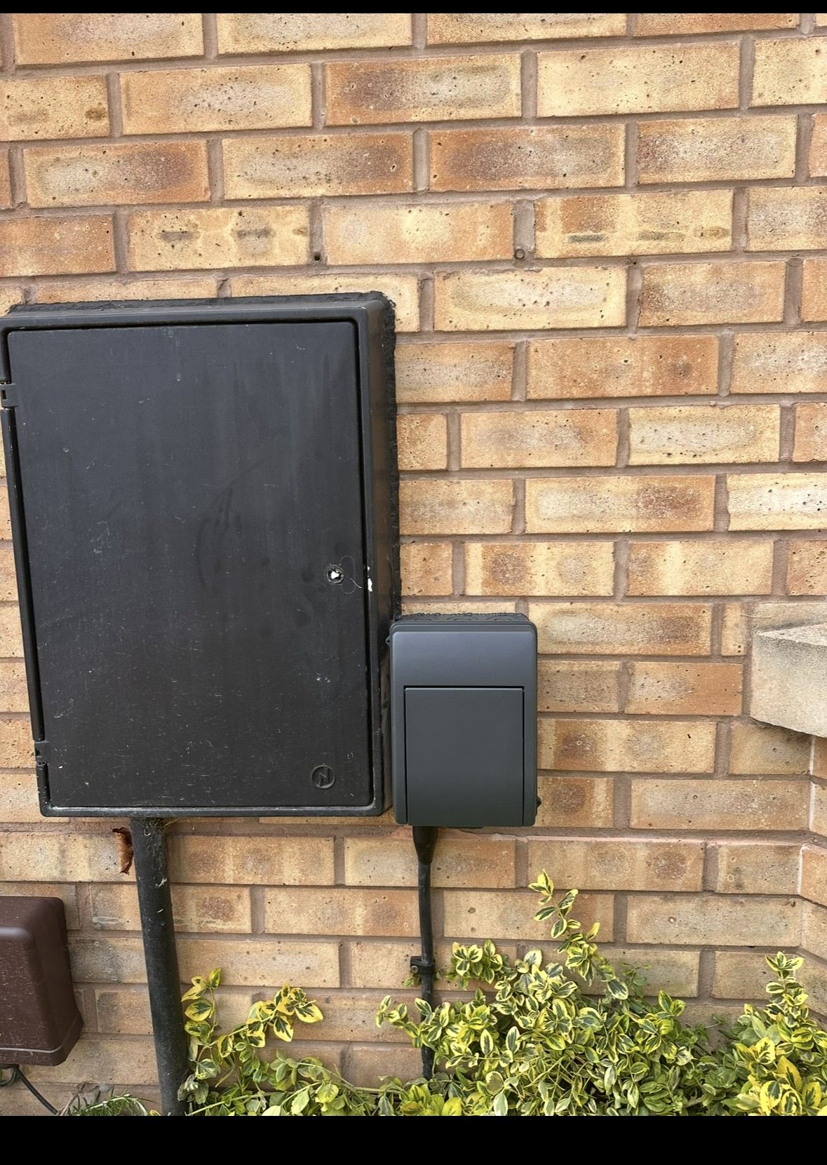 Consumer unit and EV charger installation on brick wall