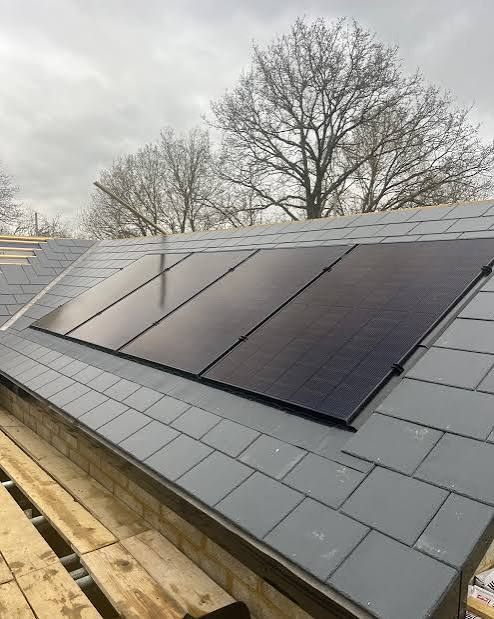 Solar panels installed on a slate roof