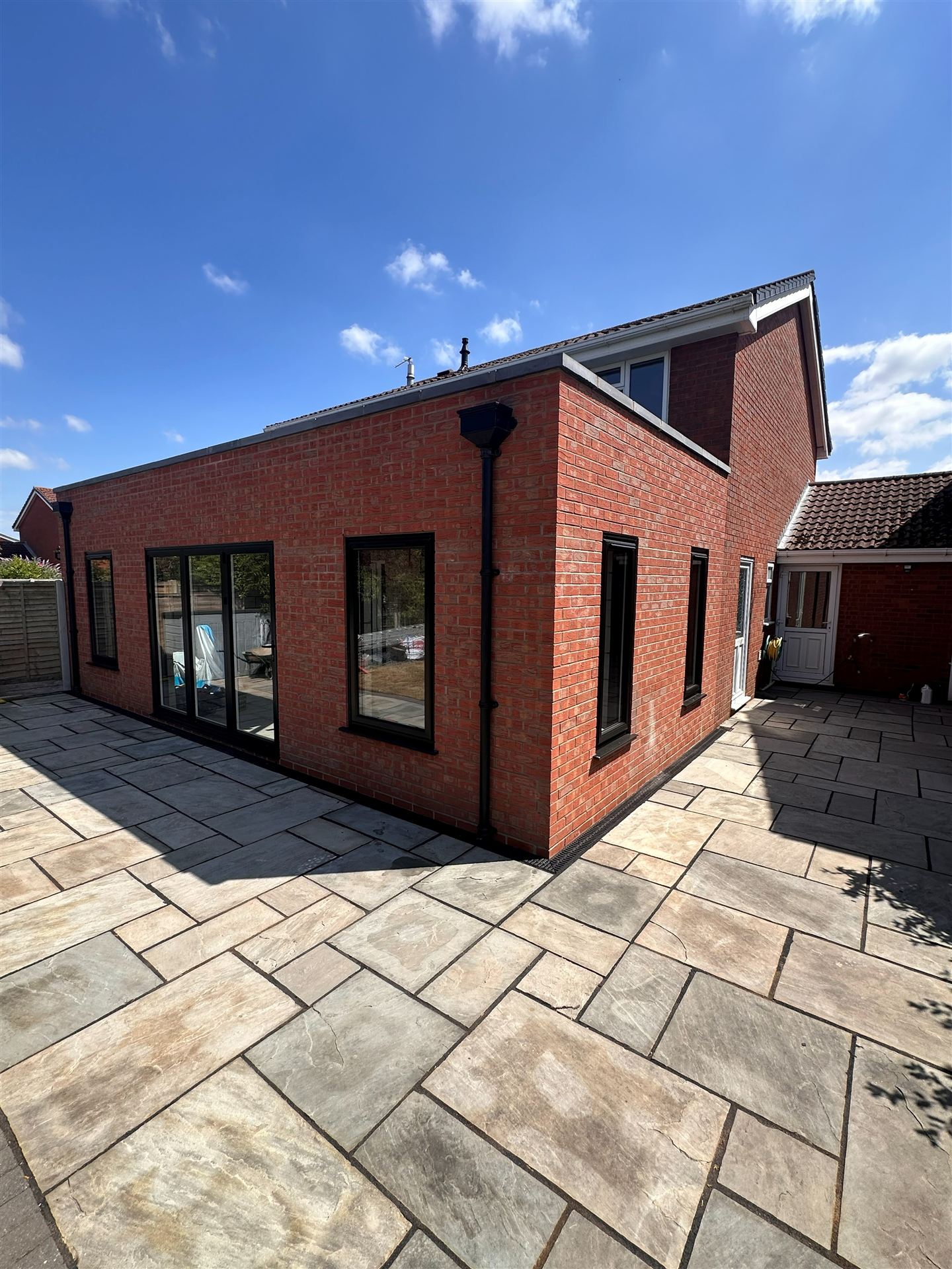 New brick-built house extension with bi-fold doors