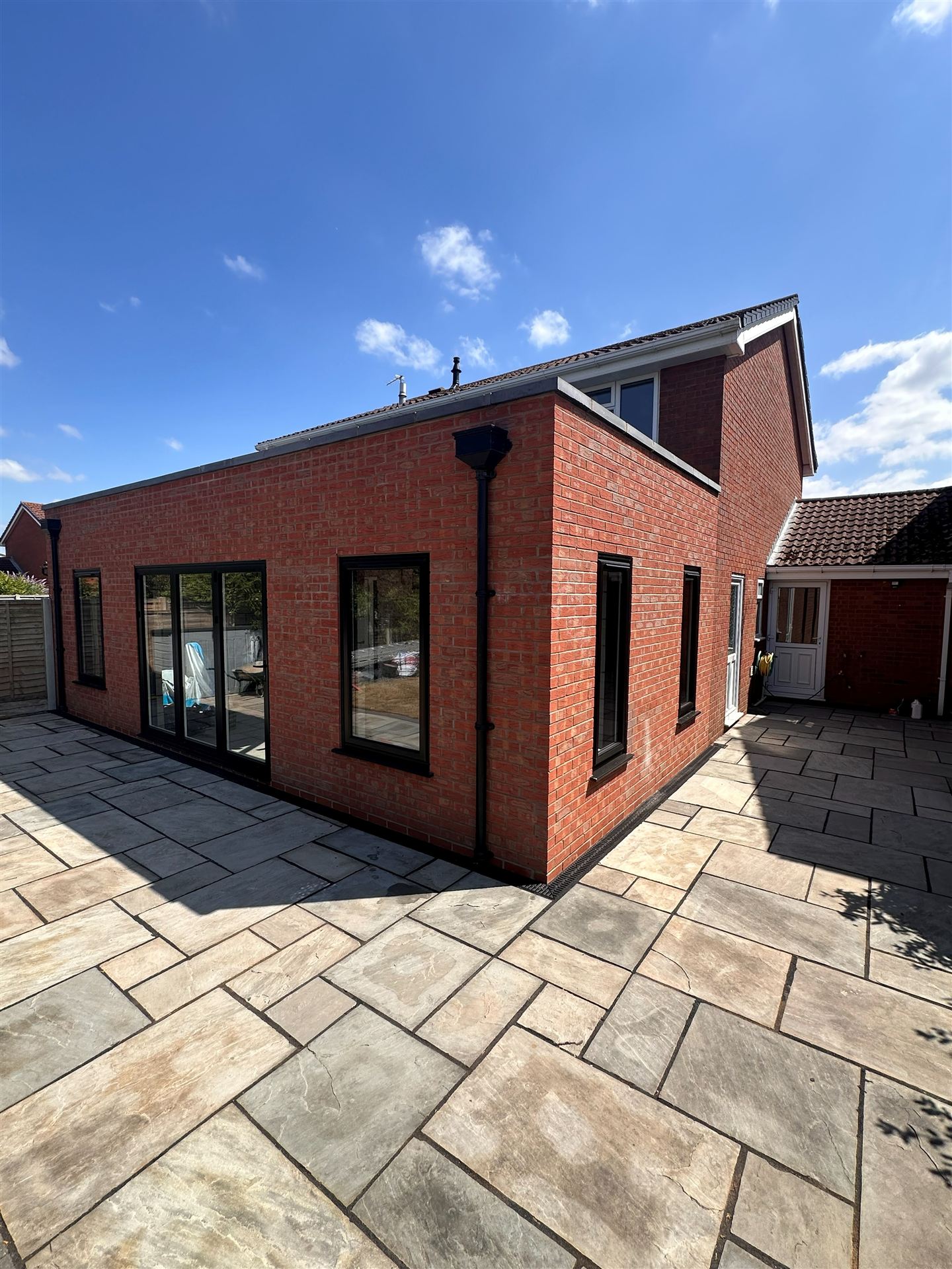 Completed red brick rear extension with dormer