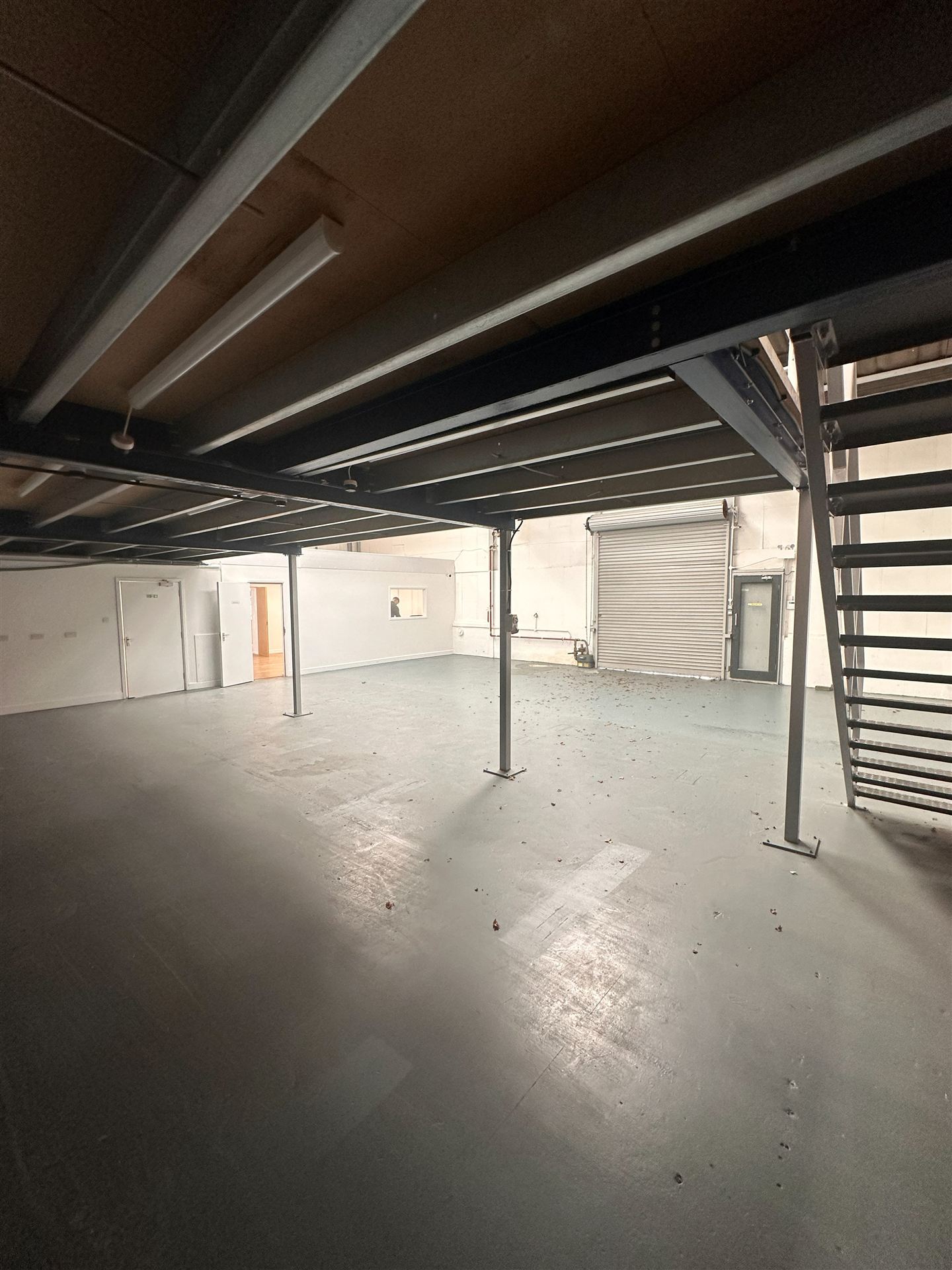 Steel mezzanine structure inside the empty unit
