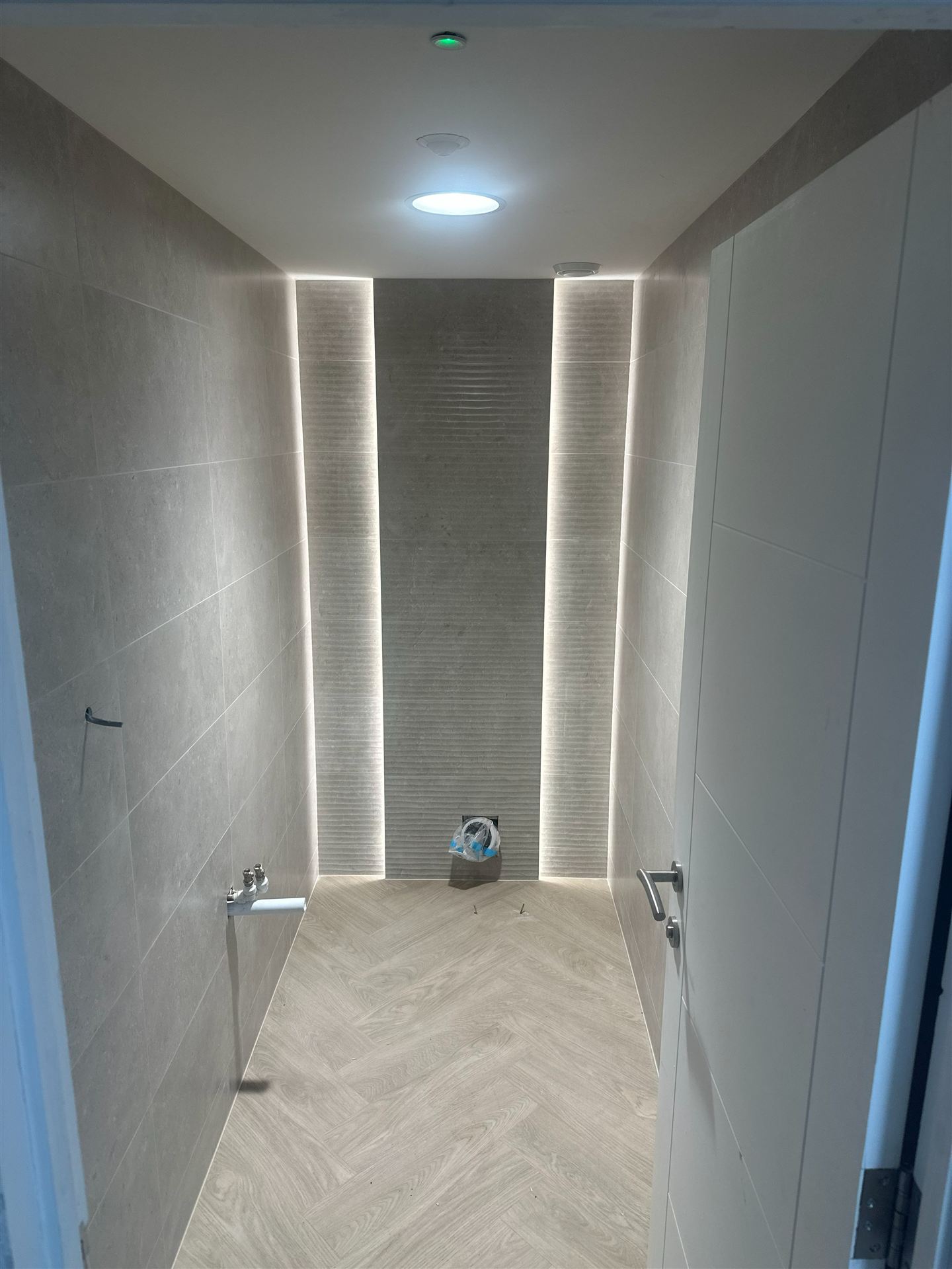 Finished wet room with backlit tiling at Reform and Revive